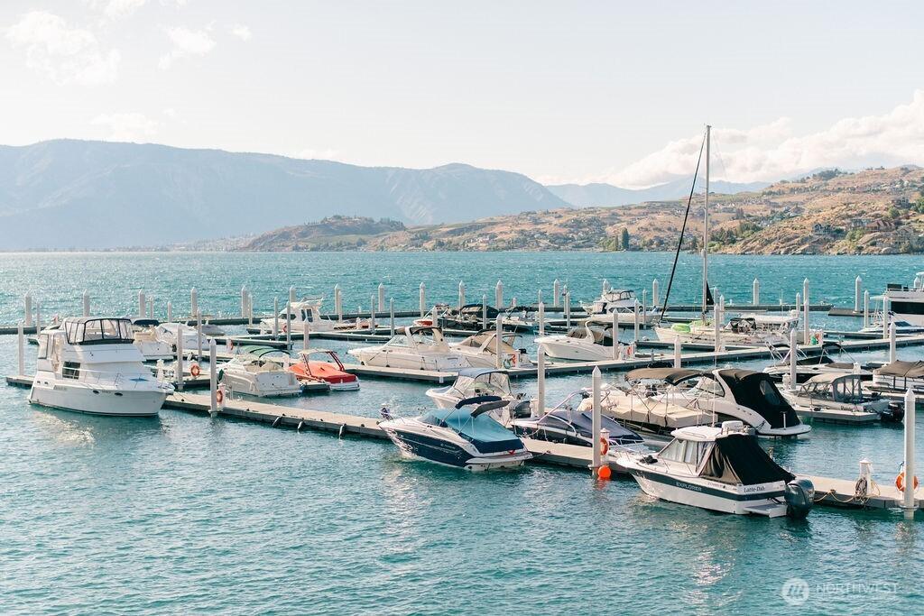 1350 W Woodin Ave Unit E-14, Chelan, WA 98816 - water view with a mountain backdrop and a boat dock