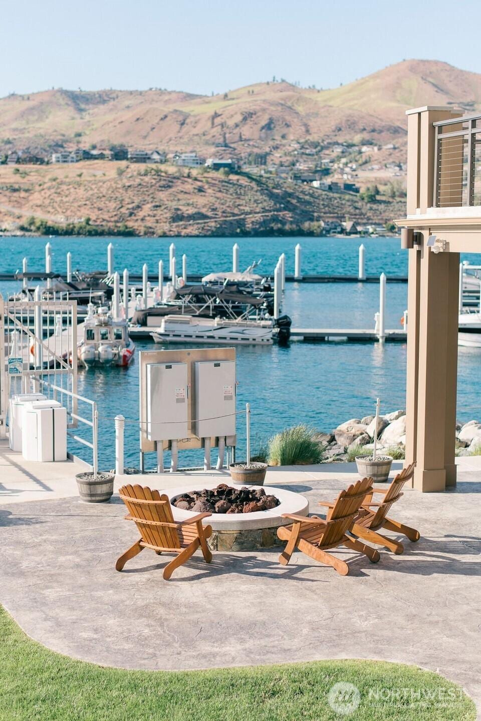 1350 W Woodin Ave Unit E-14, Chelan, WA 98816 - water view with a boat dock and a mountain backdrop