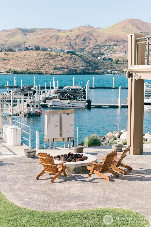 1350 W Woodin Ave Unit E-14, Chelan, WA 98816 - water view with a boat dock and a mountain backdrop