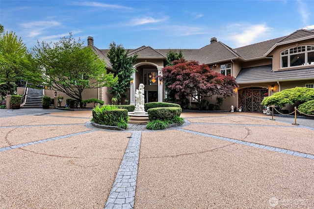 1022 7th Ct, Fox Island, WA 98333 - view of front facade featuring stucco siding and a tiled roof