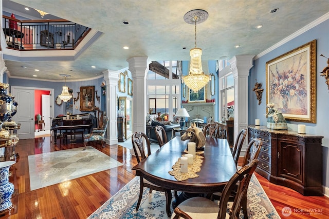 1022 7th Ct, Fox Island, WA 98333 - dining area with decorative columns, crown molding, wood finished floors, and recessed lighting