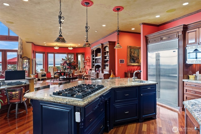 1022 7th Ct, Fox Island, WA 98333 - kitchen featuring built in appliances, dark wood-type flooring, plenty of natural light, recessed lighting, and crown molding