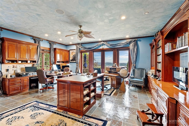 1022 7th Ct, Fox Island, WA 98333 - home office with stone tile floors, crown molding, built in desk, ceiling fan, and recessed lighting