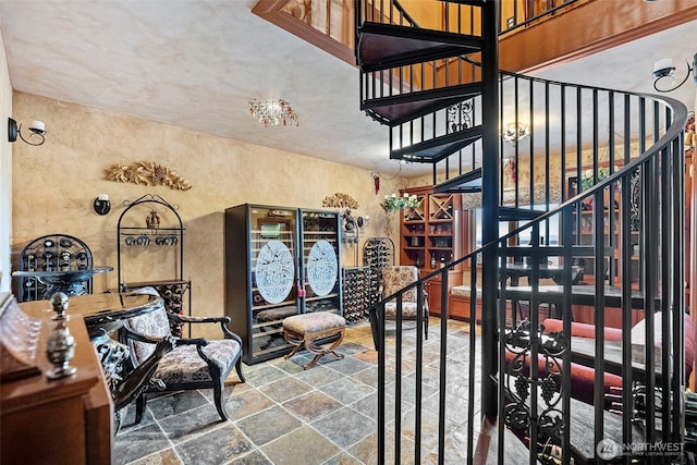1022 7th Ct, Fox Island, WA 98333 - stairs with stone finish flooring and a textured wall