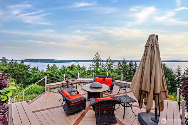 1022 7th Ct, Fox Island, WA 98333 - wooden deck with outdoor lounge area and a water view