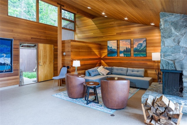 69 Rocky Rd, Crane Island, WA 98245 - living room with wood walls, high vaulted ceiling, recessed lighting, wood ceiling, and a stone fireplace