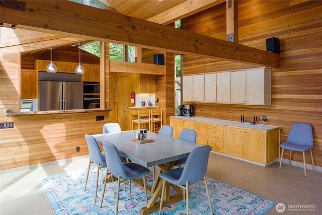 69 Rocky Rd, Crane Island, WA 98245 - dining space featuring wooden walls and carpet flooring