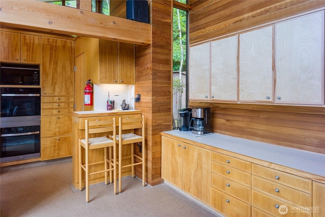 69 Rocky Rd, Crane Island, WA 98245 - kitchen with black microwave, double oven, light countertops, and light carpet