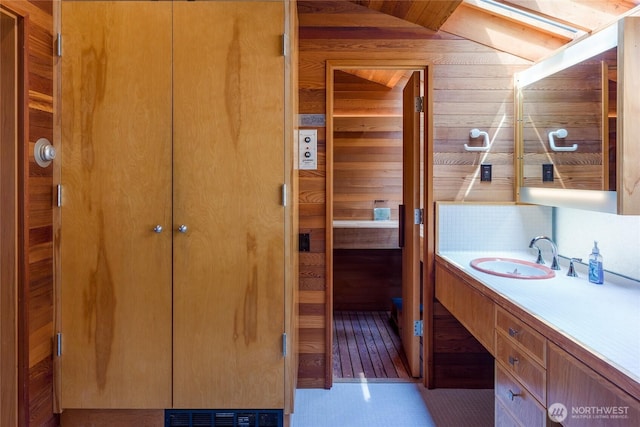 69 Rocky Rd, Crane Island, WA 98245 - bathroom featuring wooden walls and vanity