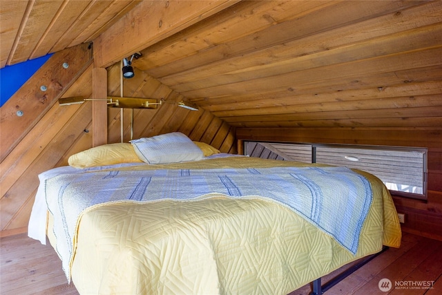69 Rocky Rd, Crane Island, WA 98245 - bedroom with vaulted ceiling, wooden walls, wooden ceiling, and hardwood / wood-style flooring