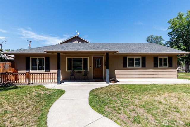1130 Central Dr, Coulee Dam, WA 99116 - ranch-style home featuring a porch, a shingled roof, and a front yard