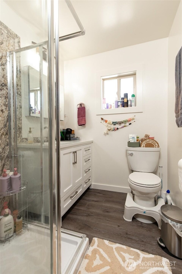 1130 Central Dr, Coulee Dam, WA 99116 - full bathroom featuring a stall shower, wood finished floors, and vanity