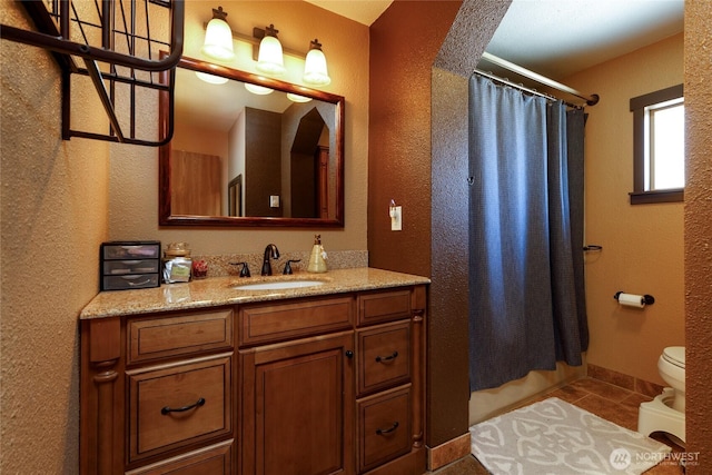 1130 Central Dr, Coulee Dam, WA 99116 - full bathroom with vanity, a shower with shower curtain, a textured wall, and tile patterned flooring