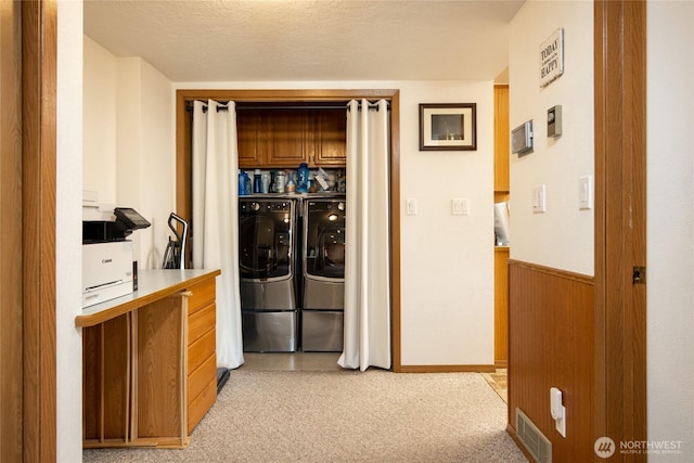 1130 Central Dr, Coulee Dam, WA 99116 - laundry room featuring separate washer and dryer, cabinet space, and light colored carpet