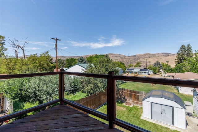 1130 Central Dr, Coulee Dam, WA 99116 - wooden terrace with a storage unit, a fenced backyard, and a mountain view