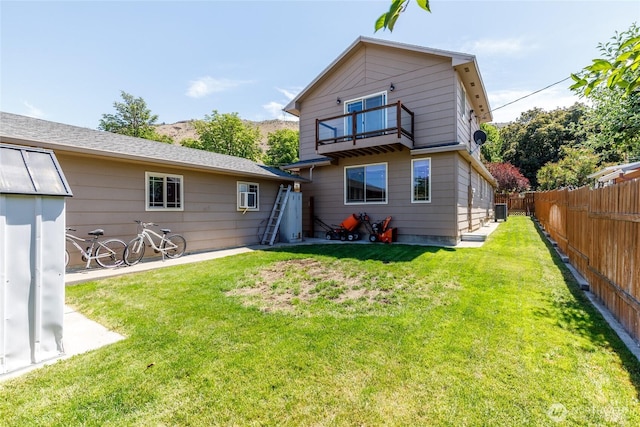 1130 Central Dr, Coulee Dam, WA 99116 - back of property featuring a balcony and a fenced backyard