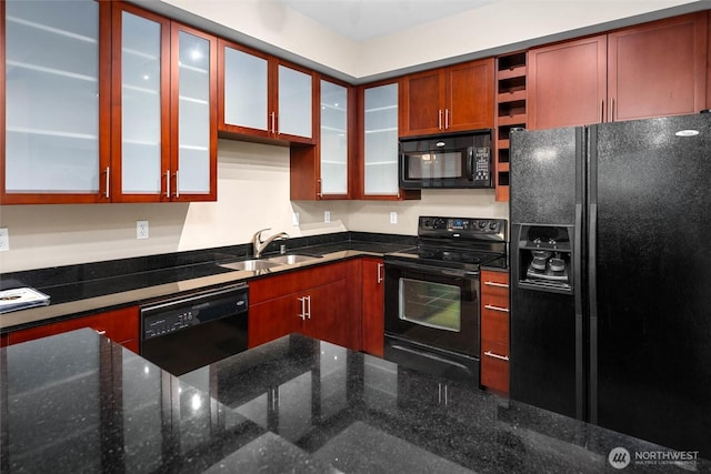 259 W Bakerview Unit 304, Bellingham, WA 98226 - kitchen featuring black appliances, dark stone counters, open shelves, and glass insert cabinets