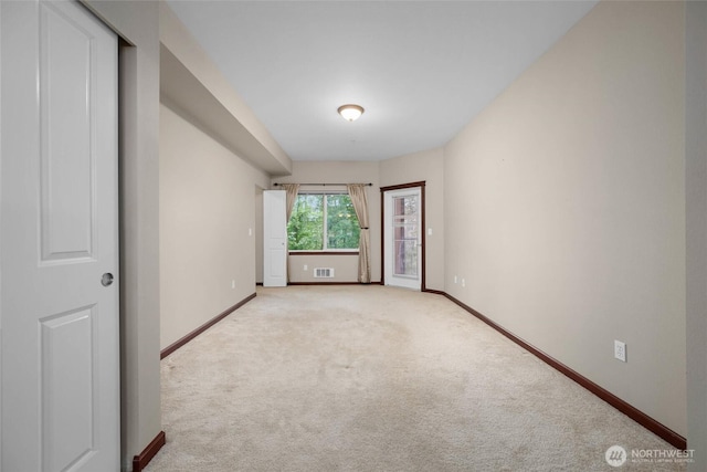 259 W Bakerview Unit 304, Bellingham, WA 98226 - spare room featuring baseboards and light carpet