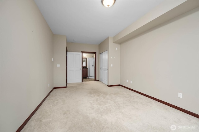 259 W Bakerview Unit 304, Bellingham, WA 98226 - spare room with baseboards and light colored carpet