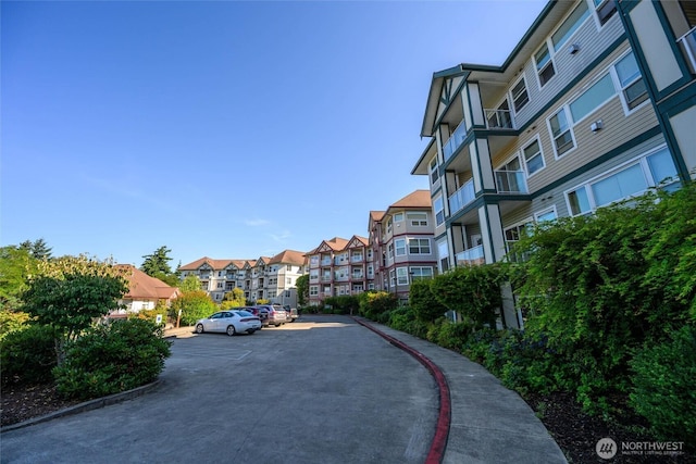 259 W Bakerview Unit 304, Bellingham, WA 98226 - view of property's community featuring uncovered parking and a residential view