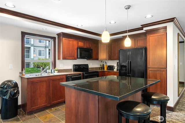 259 W Bakerview Unit 304, Bellingham, WA 98226 - kitchen with black appliances, recessed lighting, ornamental molding, a kitchen bar, and hanging light fixtures