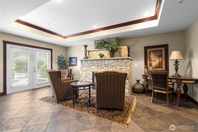259 W Bakerview Unit 304, Bellingham, WA 98226 - living area with a tray ceiling, crown molding, stone tile flooring, french doors, and recessed lighting