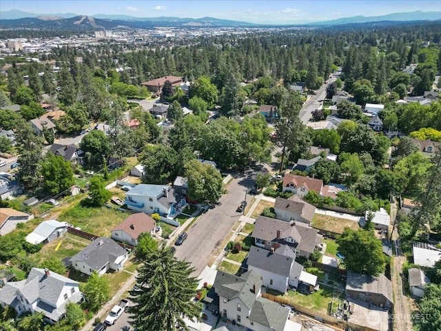 524 E 9th Ave, Spokane, WA 99202 - aerial overview of property's location with a mountain backdrop and nearby suburban area