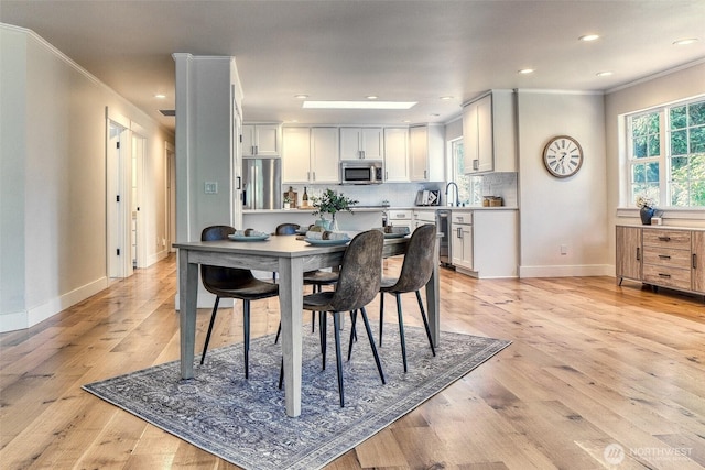 4957 Lewis Ave, Bellingham, WA 98229 - dining space with ornamental molding, light wood-style floors, and recessed lighting
