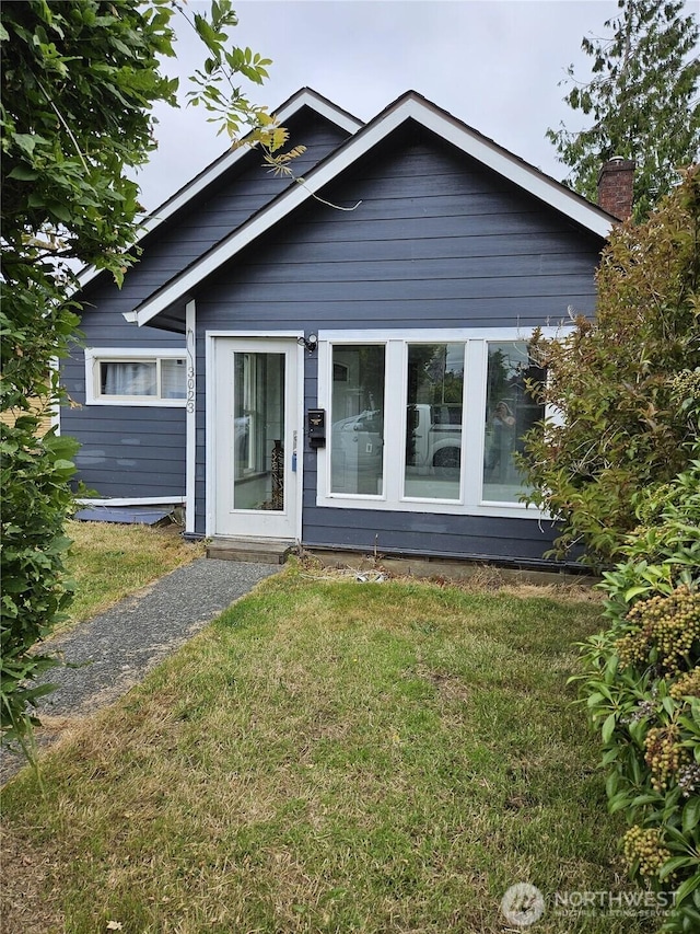 3023 Aberdeen Ave, Hoquiam, WA 98550 - view of front of house featuring a front yard and a chimney
