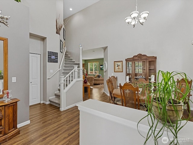 12732 69th Dr SE, Snohomish, WA 98296 - foyer featuring a towering ceiling, a chandelier, stairway, and wood finished floors