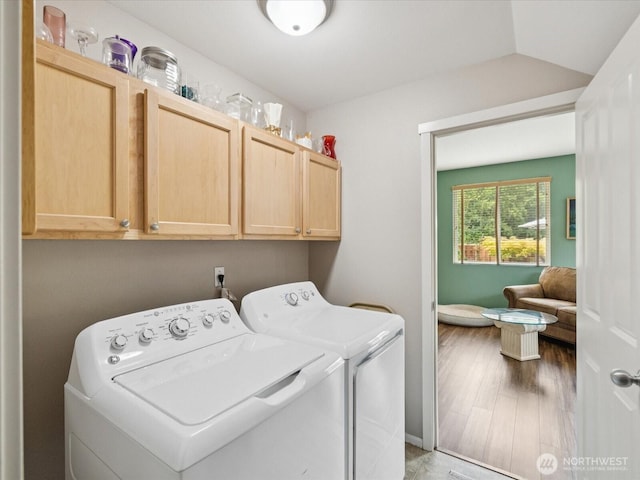 12732 69th Dr SE, Snohomish, WA 98296 - laundry room featuring cabinet space, washer and dryer, and wood finished floors