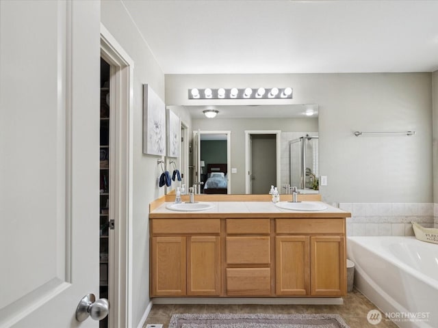 12732 69th Dr SE, Snohomish, WA 98296 - ensuite bathroom with a shower stall, a bath, tile patterned flooring, and double vanity