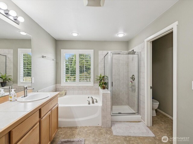 12732 69th Dr SE, Snohomish, WA 98296 - full bath with a stall shower, vanity, a garden tub, and tile patterned floors