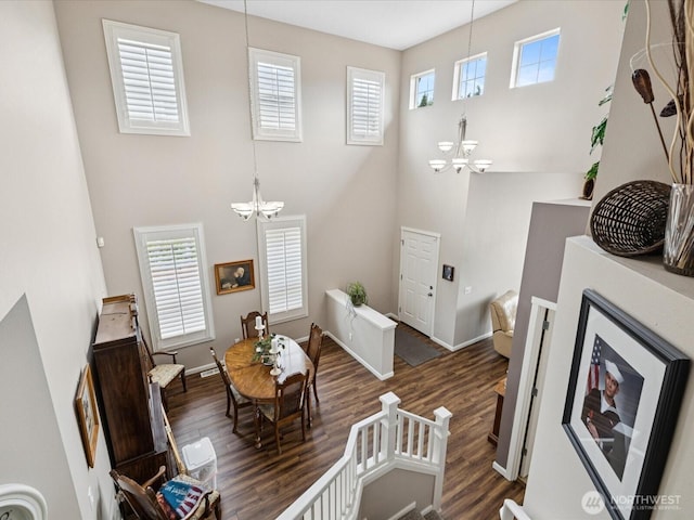 12732 69th Dr SE, Snohomish, WA 98296 - living room featuring a chandelier, wood finished floors, and a high ceiling