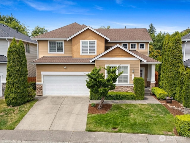 12732 69th Dr SE, Snohomish, WA 98296 - view of front of property featuring stone siding, a garage, driveway, a front yard, and roof with shingles