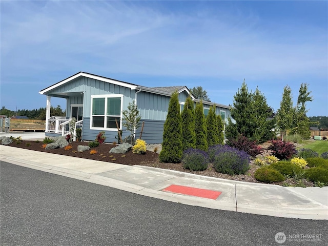 986 N Rock Rose Ave, Sequim, WA 98382 - view of front of home featuring board and batten siding and covered porch