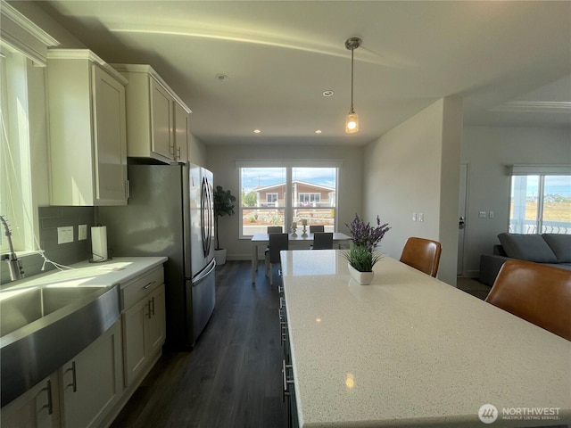 986 N Rock Rose Ave, Sequim, WA 98382 - kitchen featuring dark wood-type flooring, white cabinets, a center island, open floor plan, and pendant lighting