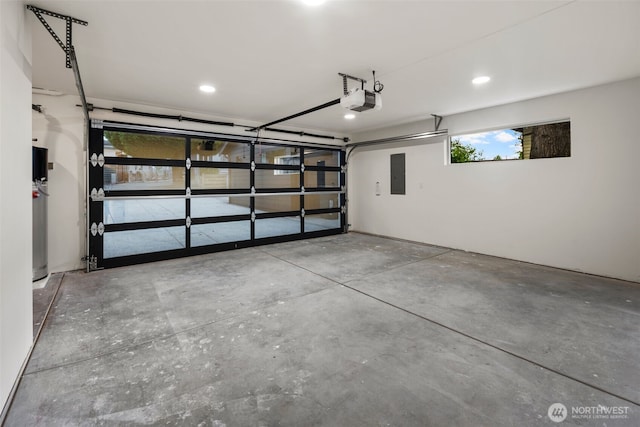 4529 S Orcas St, Seattle, WA 98118 - garage with electric panel, a garage door opener, and recessed lighting