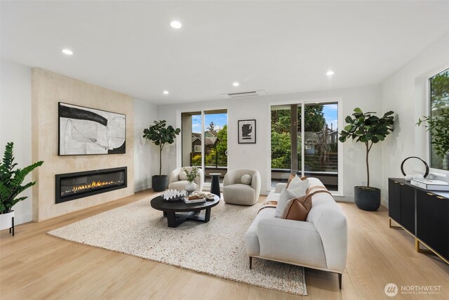 4529 S Orcas St, Seattle, WA 98118 - living room with recessed lighting, wood finished floors, and a fireplace