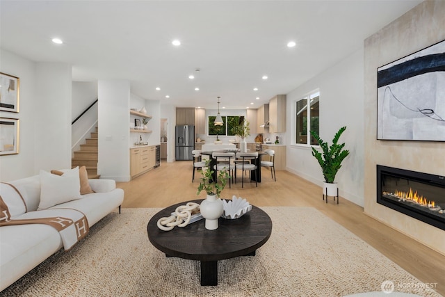 4529 S Orcas St, Seattle, WA 98118 - living area featuring light wood-style floors, recessed lighting, a fireplace, and stairway