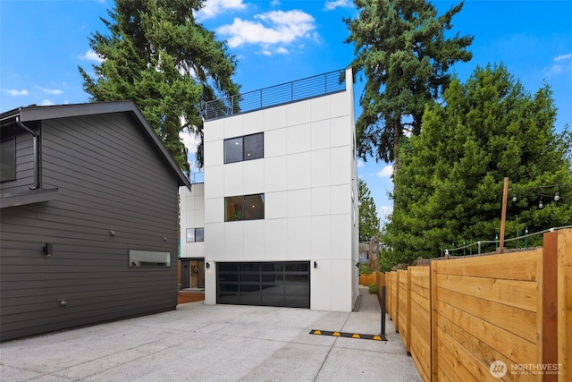 4529 S Orcas St Unit B, Seattle, WA 98118 - view of home's exterior with a detached garage