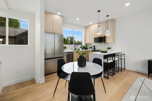 4529 S Orcas St Unit B, Seattle, WA 98118 - dining space featuring light wood finished floors and recessed lighting