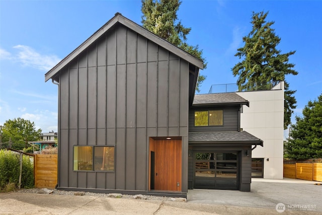 4525 S Orcas St, Seattle, WA 98118 - view of front of home featuring a shingled roof and board and batten siding
