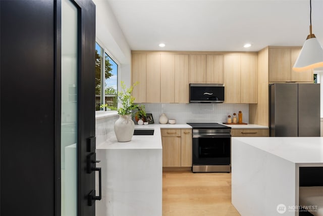 4525 S Orcas St, Seattle, WA 98118 - kitchen with stainless steel appliances, light brown cabinets, modern cabinets, light countertops, and recessed lighting