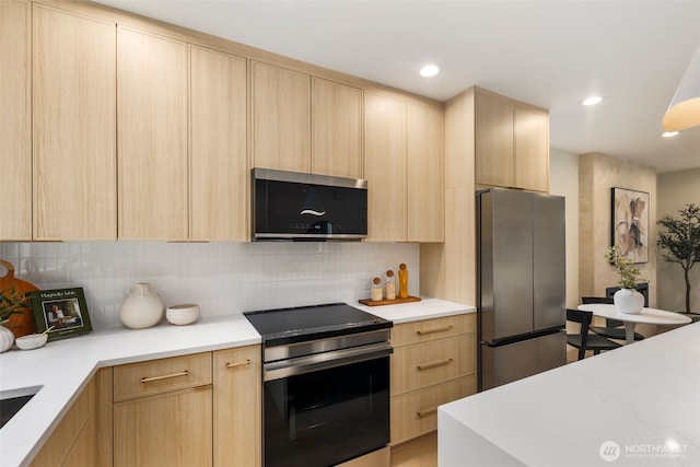 4525 S Orcas St, Seattle, WA 98118 - kitchen with stainless steel appliances, light brown cabinets, light countertops, decorative backsplash, and recessed lighting