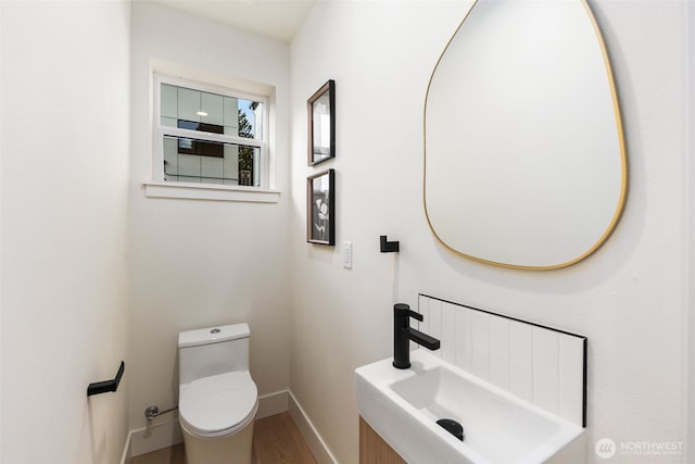 4525 S Orcas St, Seattle, WA 98118 - bathroom featuring a sink and wood finished floors