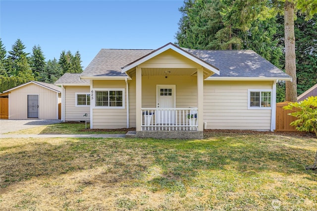 625 SW 122nd St, Seattle, WA 98146 - view of front of house featuring a shingled roof, an outdoor structure, and covered porch
