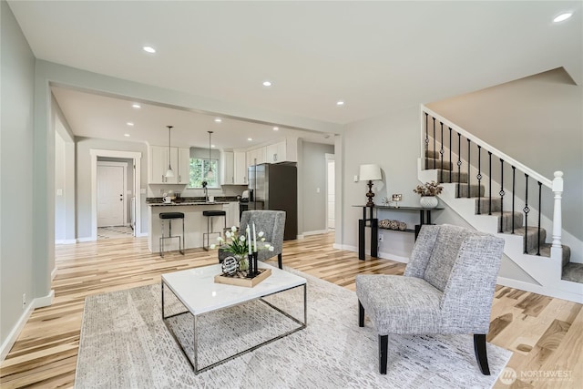 625 SW 122nd St, Seattle, WA 98146 - living room featuring light wood-type flooring, recessed lighting, and stairway