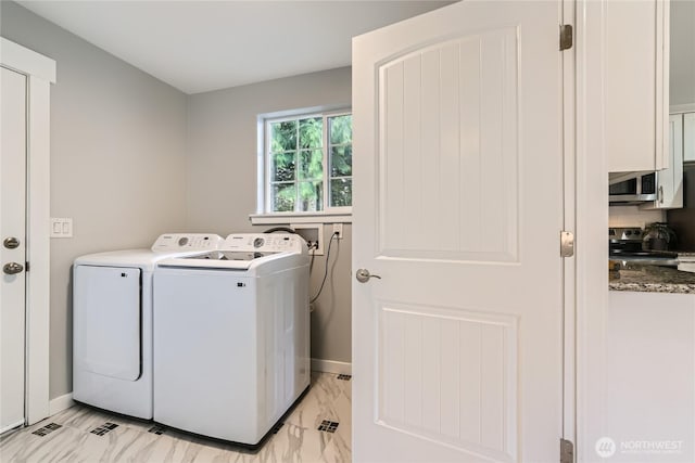 625 SW 122nd St, Seattle, WA 98146 - laundry room with independent washer and dryer and light marble finish flooring