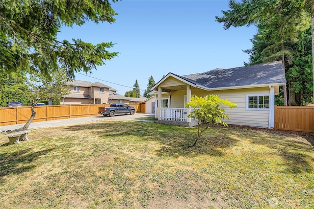 625 SW 122nd St, Seattle, WA 98146 - back of property with covered porch and a shingled roof